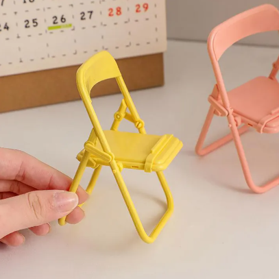 Soporte de celular en forma de silla, holder compacto y versátil